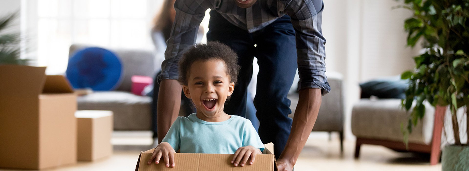 father-and-son-playing-with-box-at-home